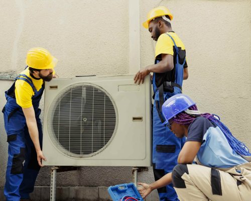 team-replacing-old-air-conditioner-min